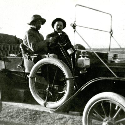 L. Viola's Crooks dad and friend sitting in an old carriage car.