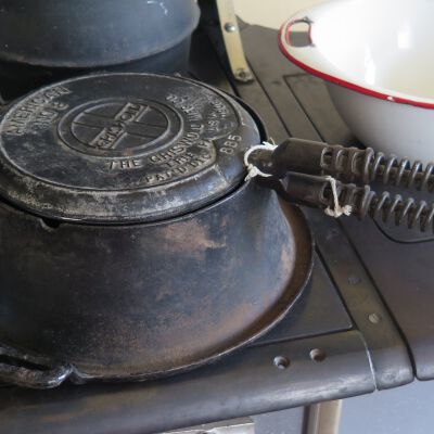 Waffle iron on exhibit.: Origsize: 5" (h) x 16" (w) x 1; Origformat: Artifact