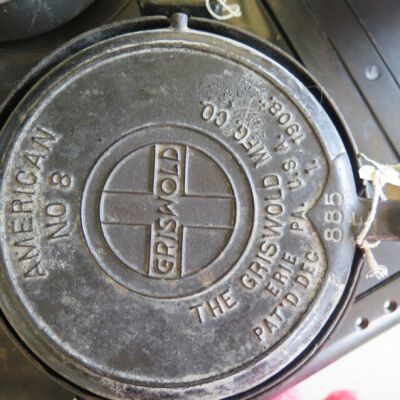 Text embossed on one side of waffle iron.: Origsize: 5" (h) x 16" (w) x 1; Origformat: Artifact