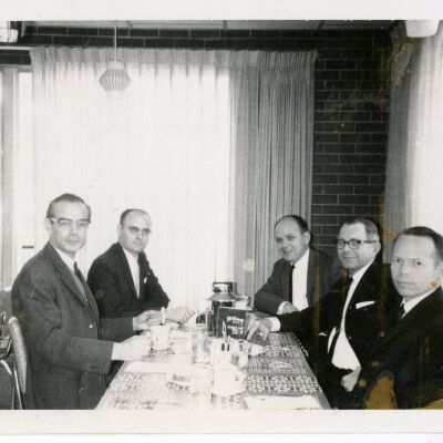 5 Men At A Table