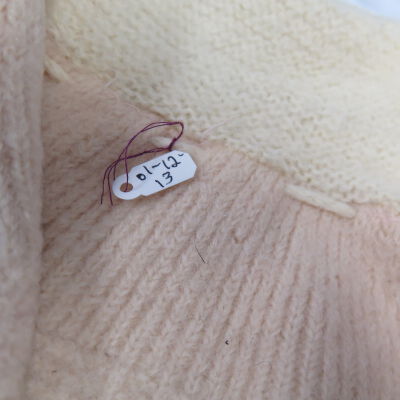 Number on sweater.: Origsize: 10" (w) x 17" (l); Origformat: Artifact