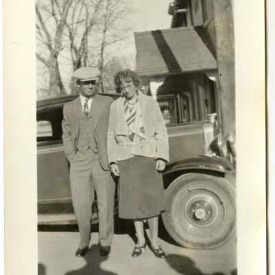 Gus Mayor and Blanche Brown Mayor Posing By a Car