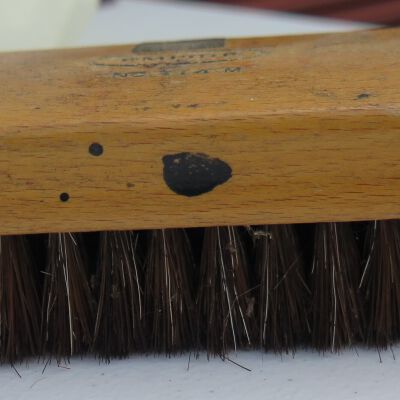 Shoe shine kit brush in off-site storage
