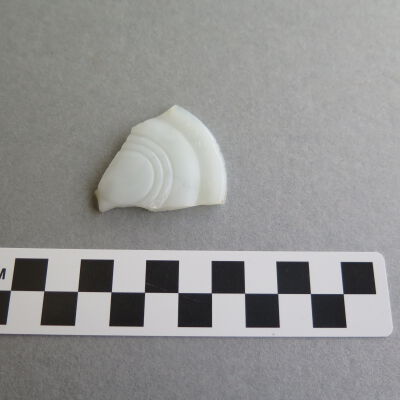 Other side of lid.: Origsize: .5" (h) x 3.5" (w) x; Origformat: Artifact