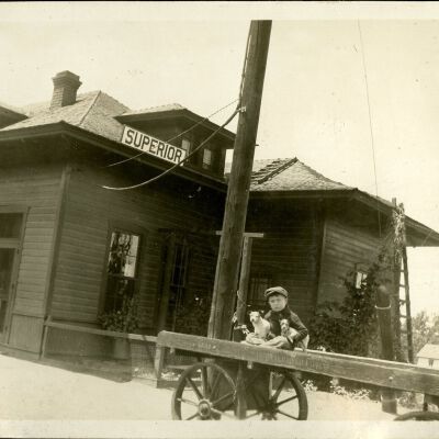 Robert Hillen on a luggage wagon, Superior train depot, circa 1927: Origsize: 3 1/2" x 5 3/4"; Origformat: Print-Photographic; Resolution: 300dpi