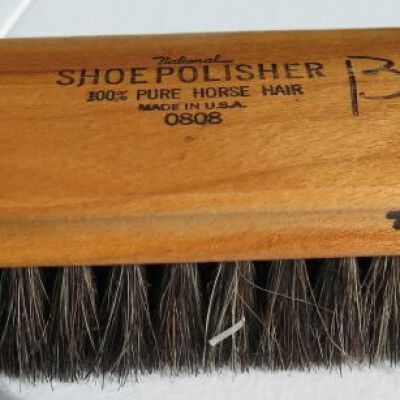 Shoe shine kit brush in off-site storage