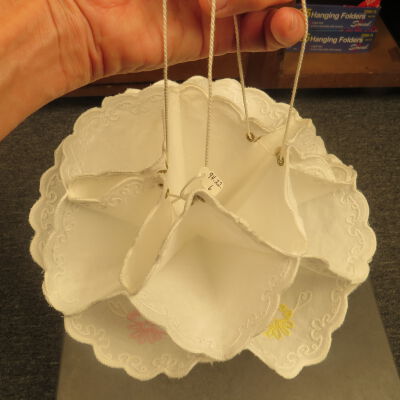 Warmer held up by sting.: Origsize: 11" (diam)
