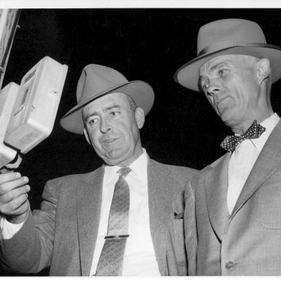 Two Men Flipping a Light Switch