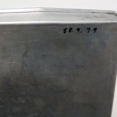 Back of baking pan: Origsize: 1" (h) x 9.5" (w) x; Origformat: Artifact