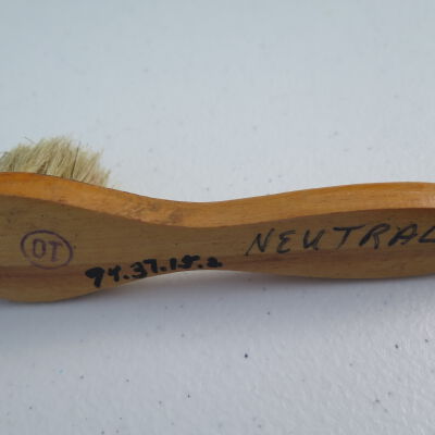 Shoe shine kit brush in off-site storage