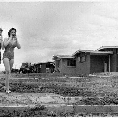 Two Ladies in Swimsuits at Construction Site