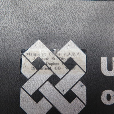 Close up of sticker on money bags.: Origsize: 10" (w) x 5.5" (l); Origformat: Artifact
