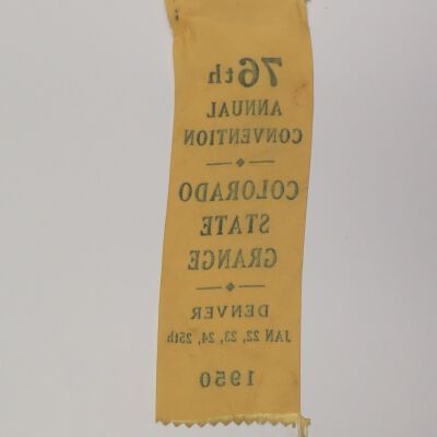 Back of nametag: Origsize: 2.5" (w) x 8" (l); Origformat: Artifact