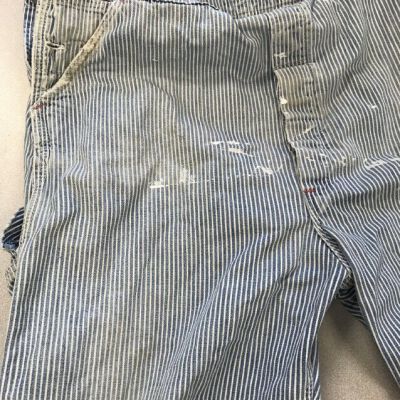 Close up of paint on overalls.: Origsize: 23.5" (w) x 59" (l); Origformat: Artifact