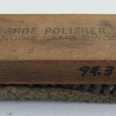 Shoe shine kit brush in off-site storage