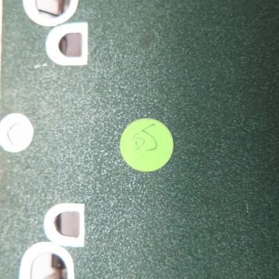 Close up of sticker on back of clipboard.: Origsize: 4.5" (w) x 7" (l); Origformat: Artifact