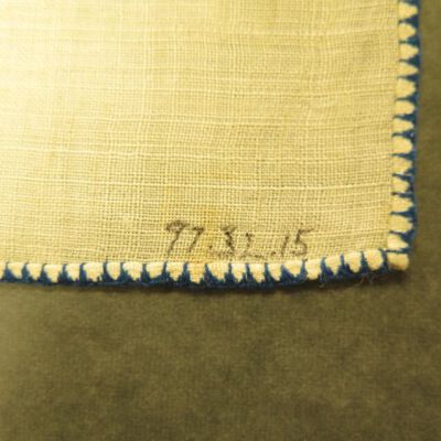 Close up of number on furniture scarf.: Origsize: 9" (w) x 12.5" (l); Origformat: Artifact