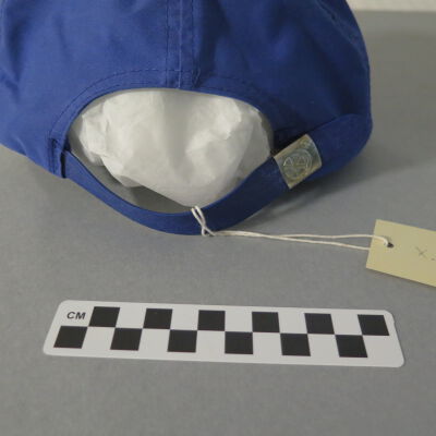 Back of hat and close up of strap.: Origsize: 5" (h) x 8" (w) x 11; Origformat: Artifact