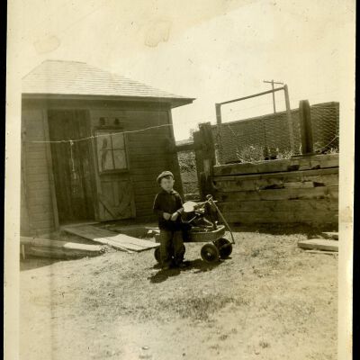 Robert Hillen playing in yard at Superior depot, 1927: Origsize: 3 1/2" x 5 3/4"; Origformat: Print-Photographic; Resolution: 300dpi