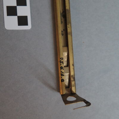 Close up of number on curtain rod.: Origsize: 0.75" (h) x 3.5" (w); Origformat: Artifact