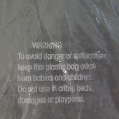 Close up of warning on bag.: Origsize: 5" (h) x 8" (w) x 11; Origformat: Artifact