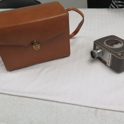 Front of case and camera.: Origsize: 6" (h) x 8.25" (w) x; Origformat: Artifact