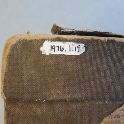 Close up of number on clipboard.: Origsize: 8" (w) x 13" (l) x 2; Origformat: Artifact