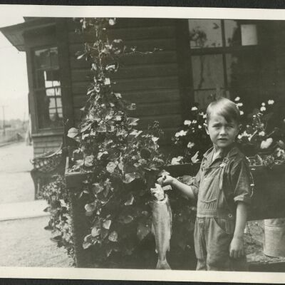 Robert Hillen with fish he caught nearby at Superior Depot, circa 1928: Origsize: 3 1/2" x 5 3/4"; Origformat: Print-Photographic; Resolution: 300dpi
