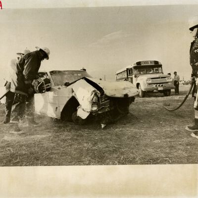 Members of West Adams Volunteer Fire Department - wrecked car