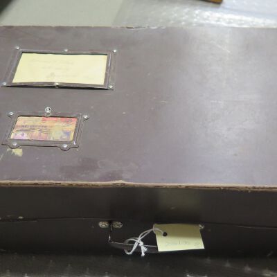 Top of suitcase: Origsize: 6" (h) x 21" (w) x 1; Origformat: Artifact