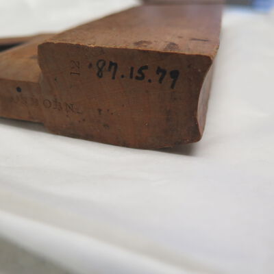 Number on wood plane.: Origsize: 1.25" (h) x 5.5" (w); Origformat: Artifact