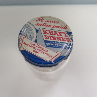 Top of lid, showing text.: Origsize: 4.25" (h) x 2" (dia); Origformat: Artifact