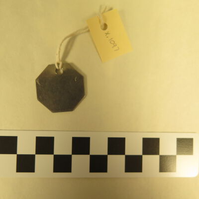 Back of tag.: Origsize: 1" (w) x 1" (l); Origformat: Artifact