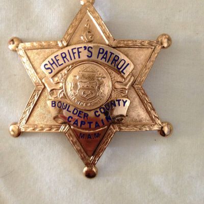 Close up of front of badge.: Origsize: 3" (w) x 3" (l); Origformat: Artifact