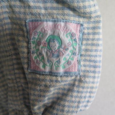 Detail on front of romper: Origsize: 8" (w) x 16" (l); Origformat: Artifact