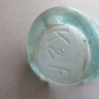 Bottom of bottle.: Origsize: 3.25" (h) x 2.5" (di; Origformat: Artifact