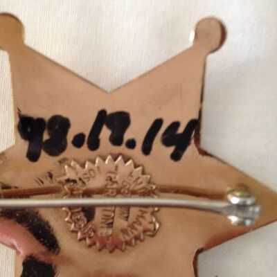 Close up of number on badge.: Origsize: 3" (w) x 3" (l); Origformat: Artifact