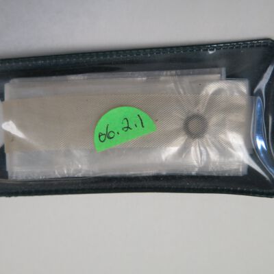 Rain bonnet or cap inside case: Origsize: 2" (w) x 4" (l); Origformat: Artifact
