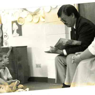 Mary Jane Bailey and Charles Ozaki Reading to Children
