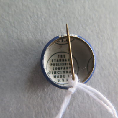 Back of Work for the Blue pins.: Origsize: 0.75" (diam); Origformat: Artifact