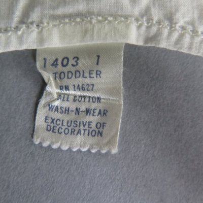 Tag on dress: Origsize: 9" (w) x 16" (l); Origformat: Artifact