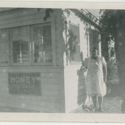 Emily Crawford by Honey stand