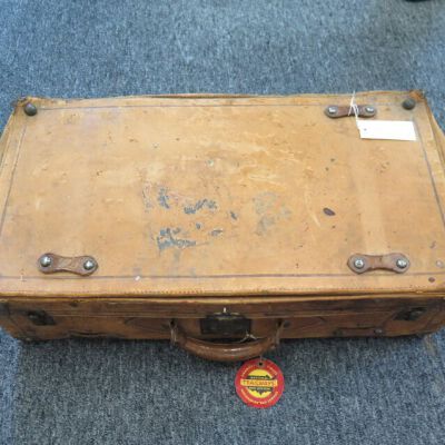 One side of suitcase.: Origsize: 15" (h) x 27" (w) x; Origformat: Artifact