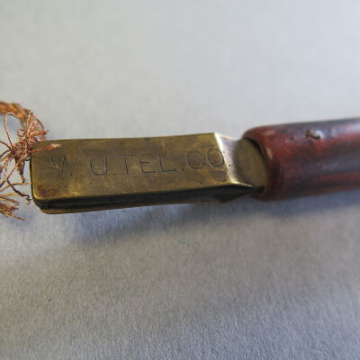 Text on wire: Origsize: 22" (l); Origformat: Artifact