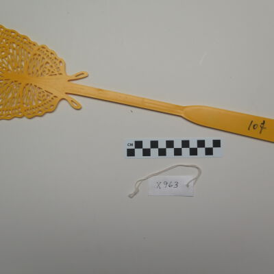 Back of fly swatter.: Origsize: 4" (w) x 15.25" (l); Origformat: Artifact