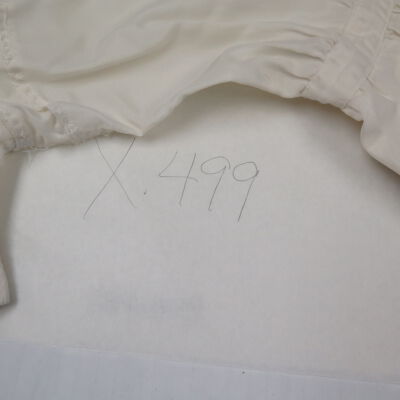 X number assigned to dress.: Origformat: Artifact
