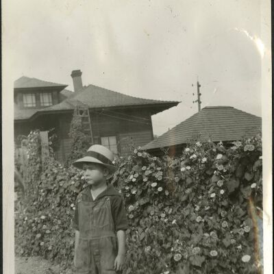 Robert Hillen standing by Clematis plants at Superior Depot, circa 1928: Origsize: 3 1/2" x 5 3/4"; Origformat: Print-Photographic; Resolution: 300dpi