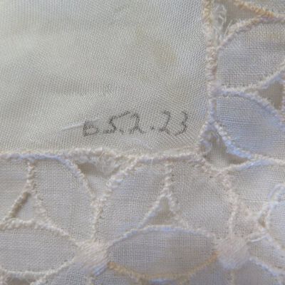 Close up of number on doily.: Origsize: 7" (w) x 14.25" (l); Origformat: Artifact