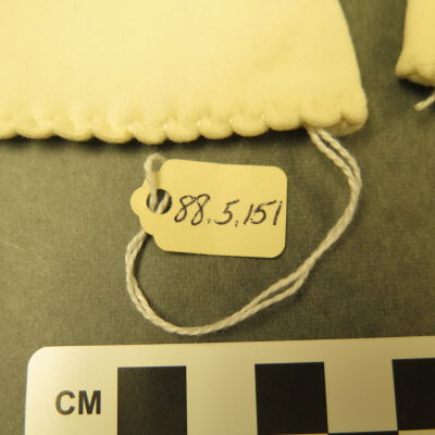 Close up of number on gloves.: Origsize: 4.5" (w) x 13.5" (l); Origformat: Artifact