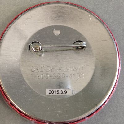 Close up of text on back of button.: Origsize: 2.5" (dia); Origformat: Artifact